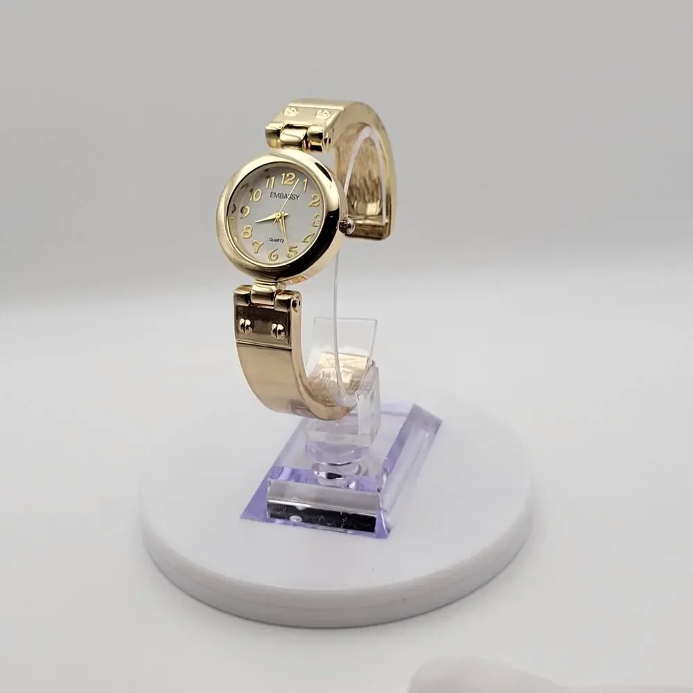 Embassy Womens Gold Tone Bangle Cuff Quartz Watch White Dial Gold Numerals